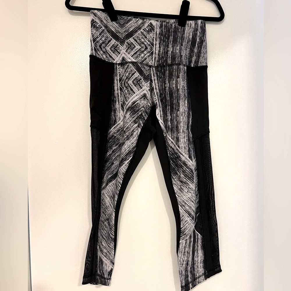 Lululemon athletic tights.  Mid calf length.  Sheer on the side.  Gently warn